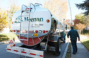Meenan service tech and Meenan oil truck