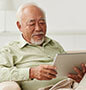 Older man looking at iPad
