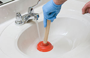 Using plunger on a clogged sink