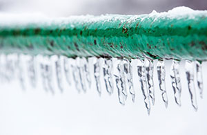 Icicles hanging on rain gutter