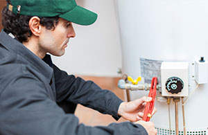 Meenan tech repairing water heater