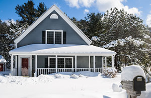 Home covered in snow